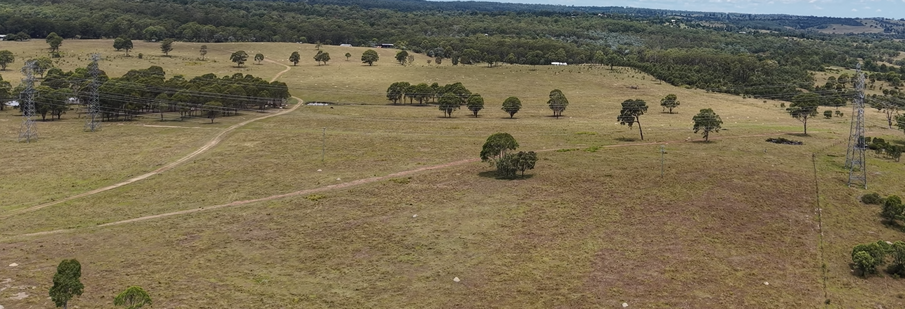 Panoramic view of the Tumuruu site with transmission infrastructure